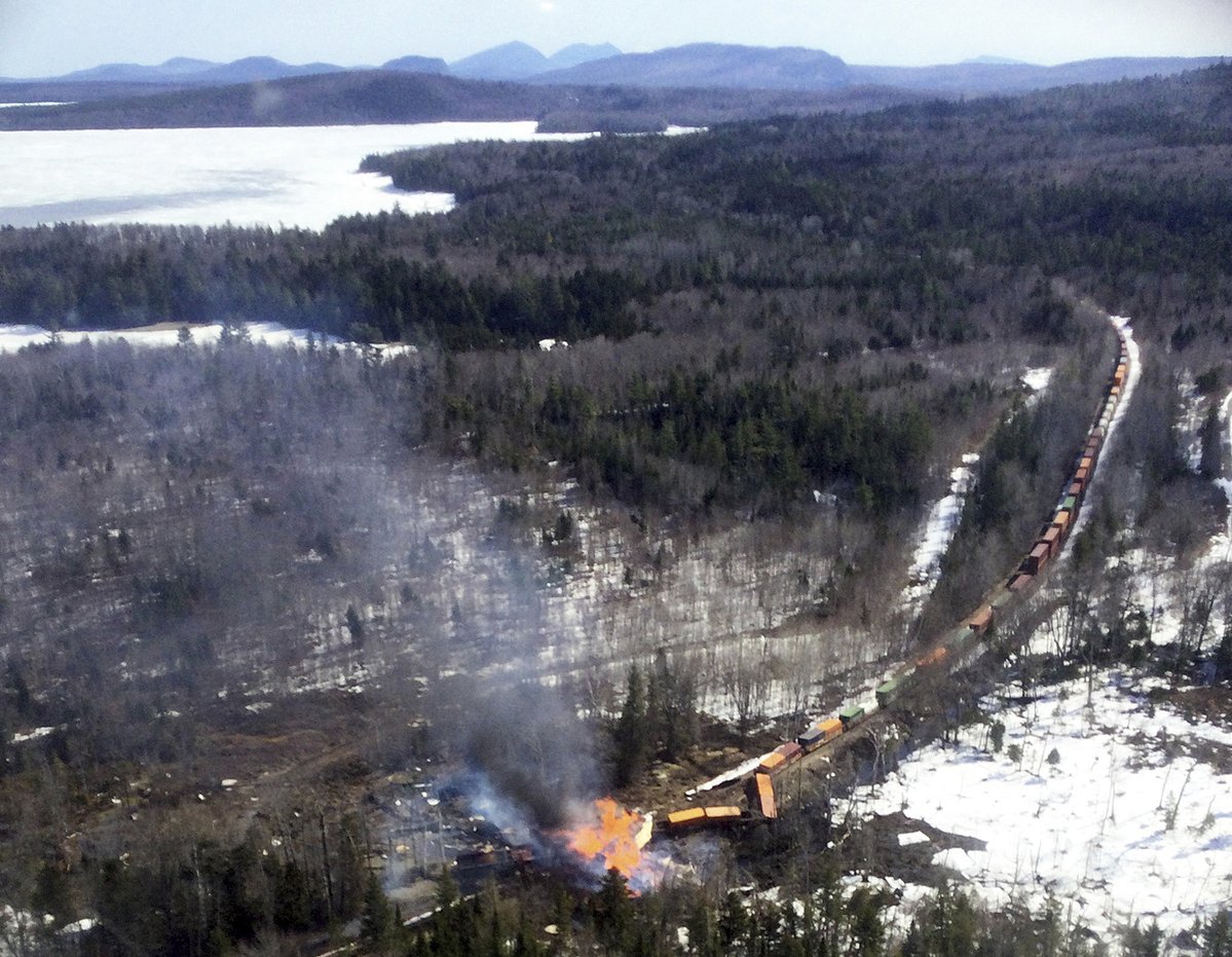Railroad employee was fired after being injured in fiery Maine derailment, lawsuit says