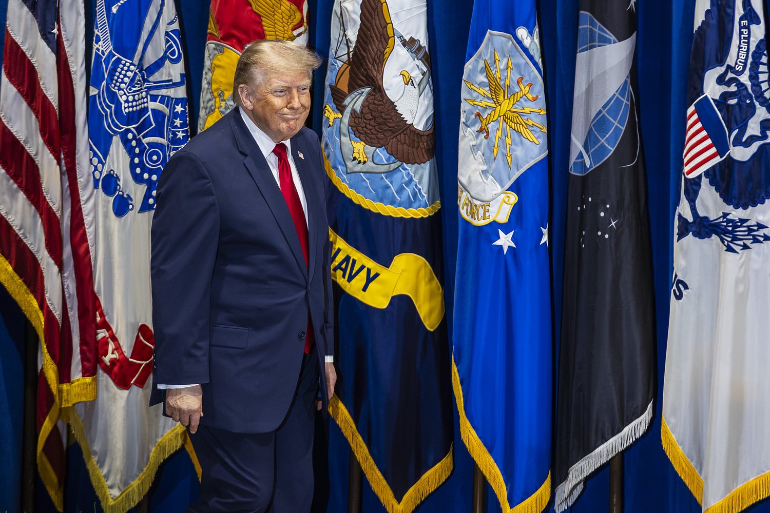 At the end, a party: Trump hailed at defense summit for record security spending