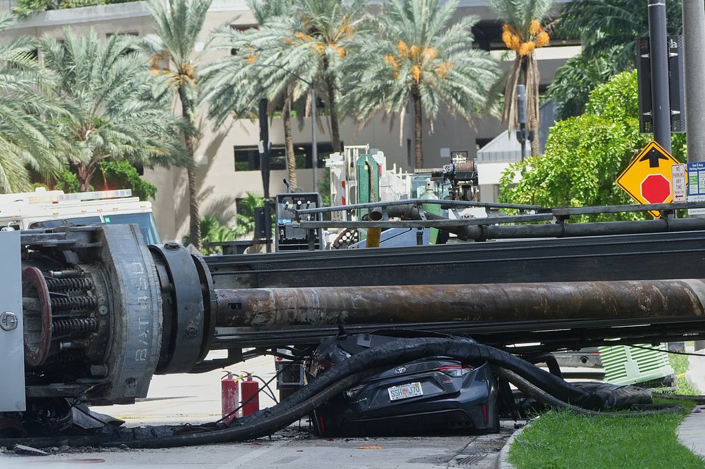 Officials say 4 people were hospitalized after a crane collapsed at a Miami construction site