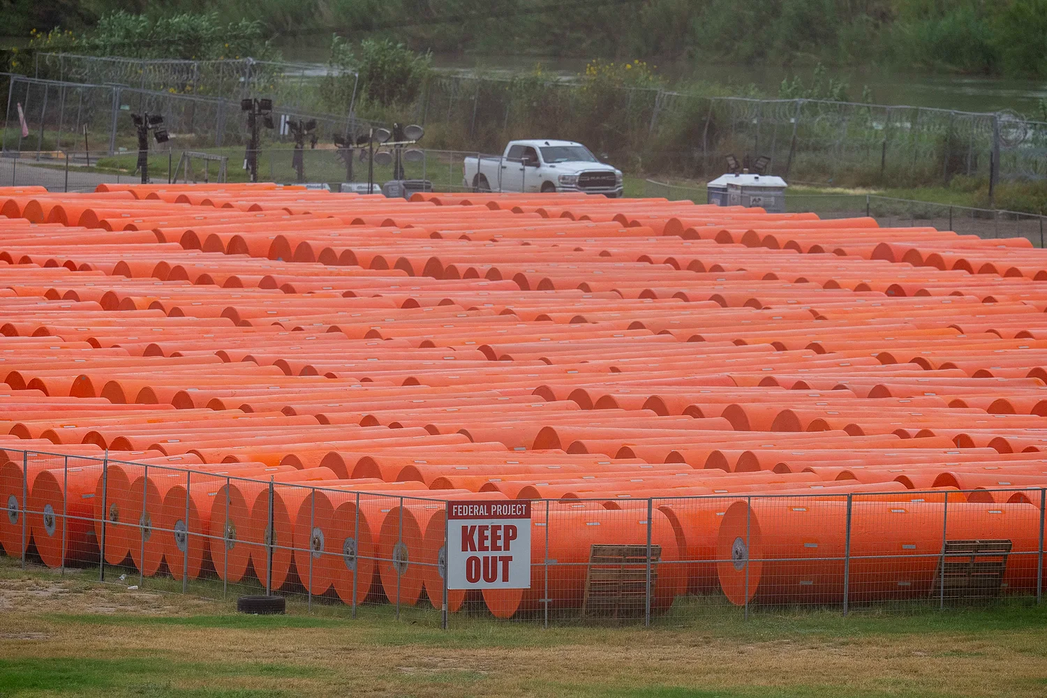 Anti-immigrant buoys that went adrift amid Rio Grande flooding force closure of key bridge to Mexico
