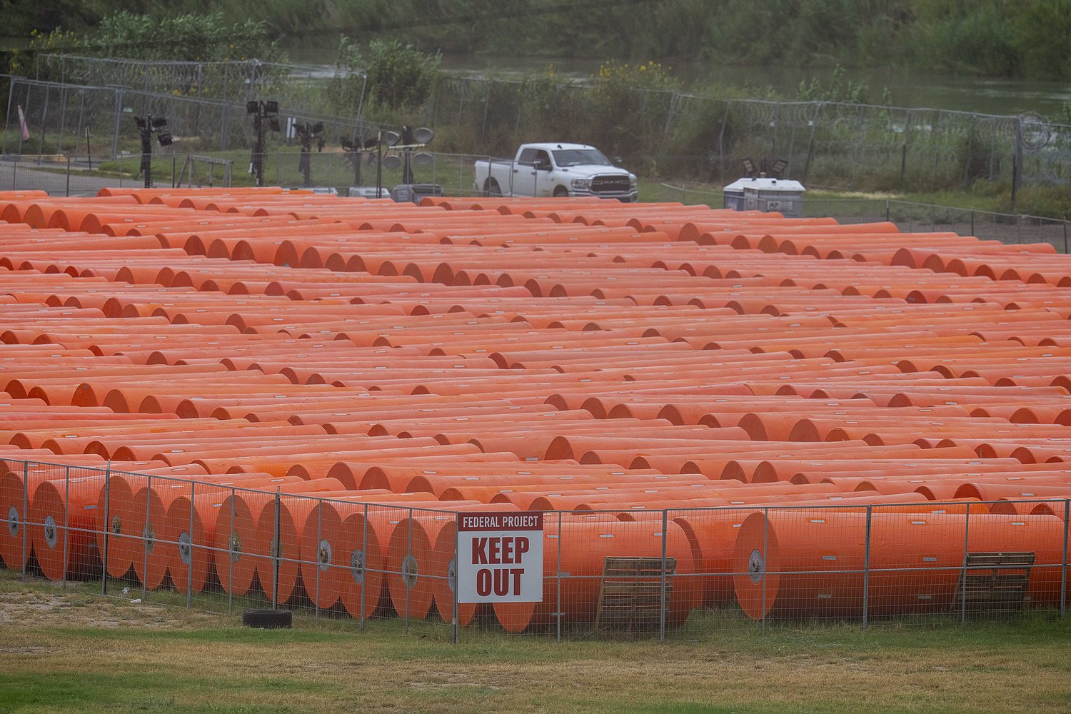 Anti-immigrant buoys that went adrift amid Rio Grande flooding force closure of key bridge to Mexico