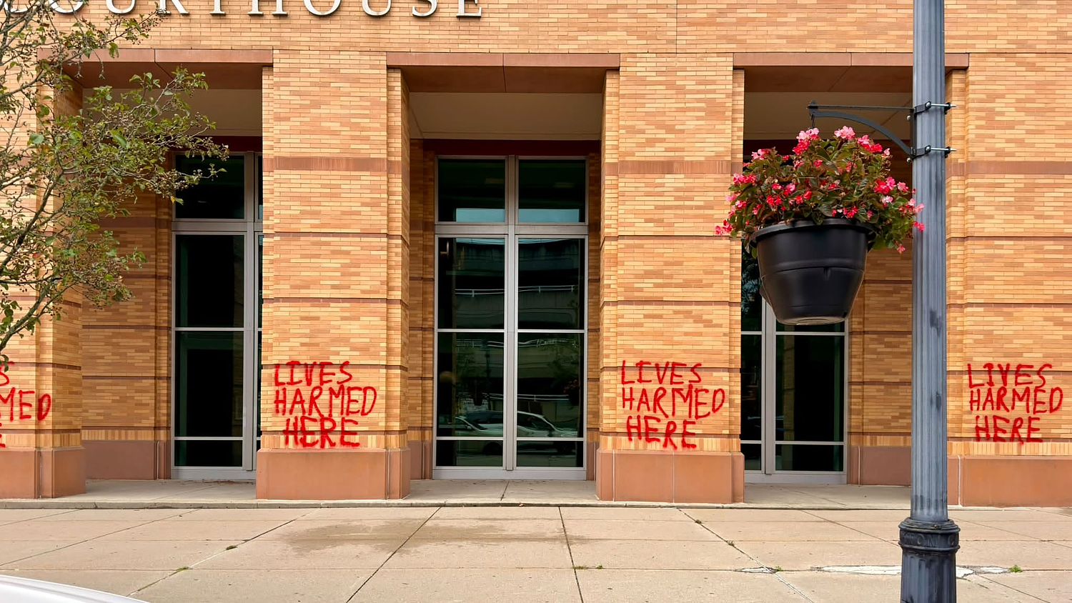 Man charged in Brockton courthouse for spray-painting ‘LIVES HARMED HERE’ on it, DA says