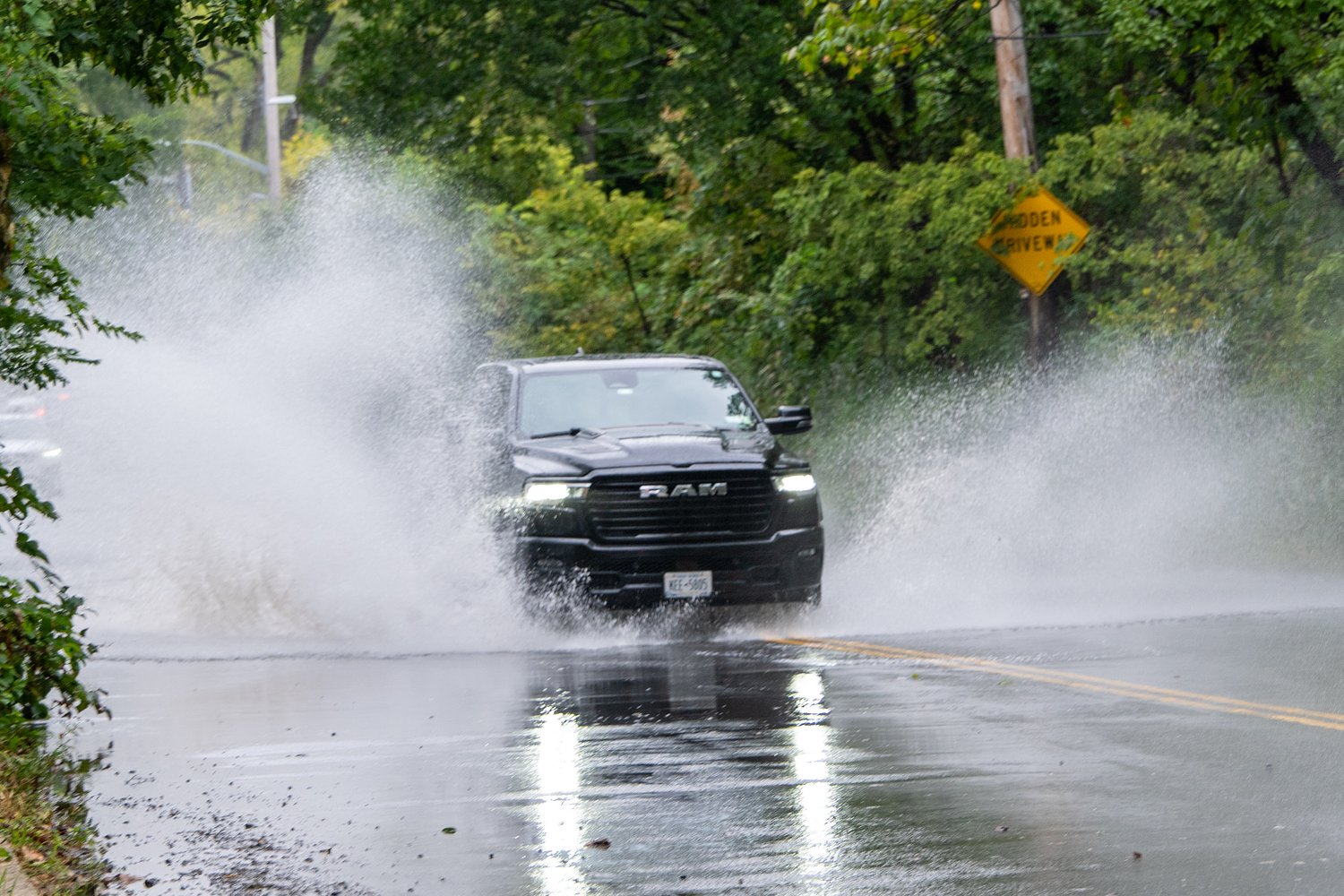 S.I. driver rescued by FDNY; heavy rain forces road closures Saturday morning