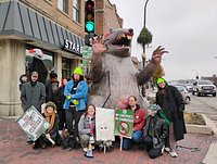 Starbucks’ baristas strike, picket Geneva location with giant rat