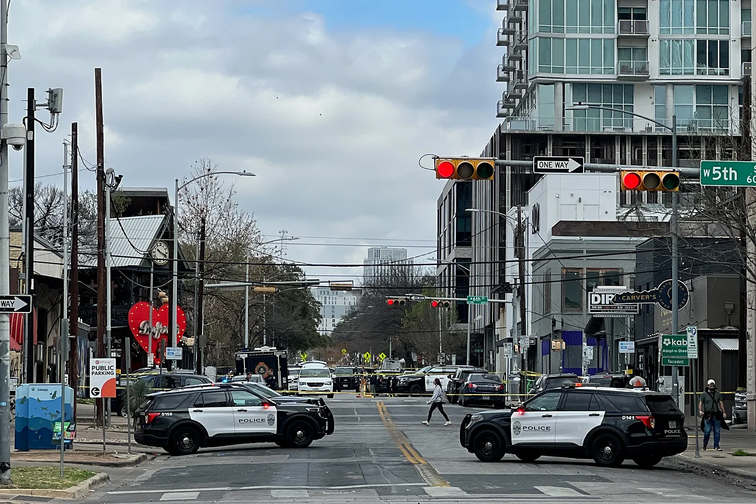 Three dead, including suspect, and 14 injured after shooting at Austin bar