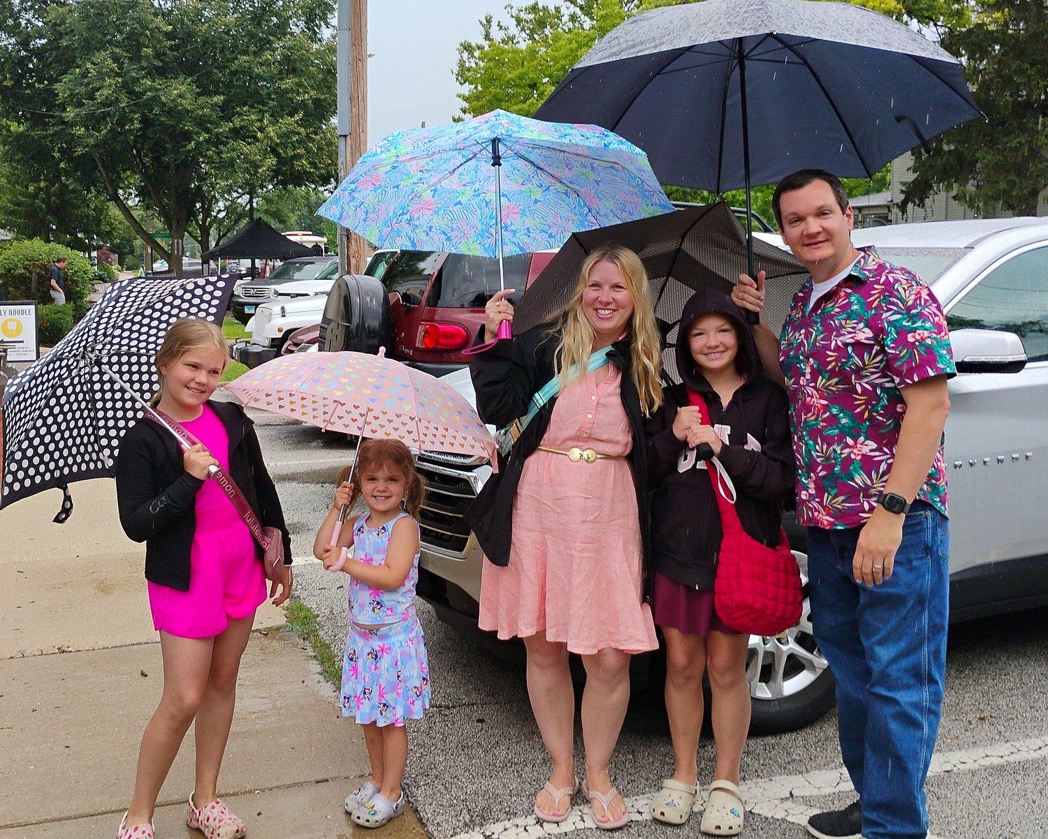 Rain slows 1st day of Swedish Days, not enough to sway shoppers: ‘But we’re having some fun’