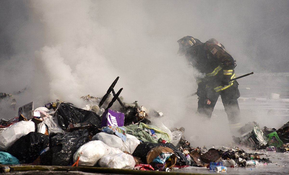 Garbage truck dumps load of burning trash in Bangor