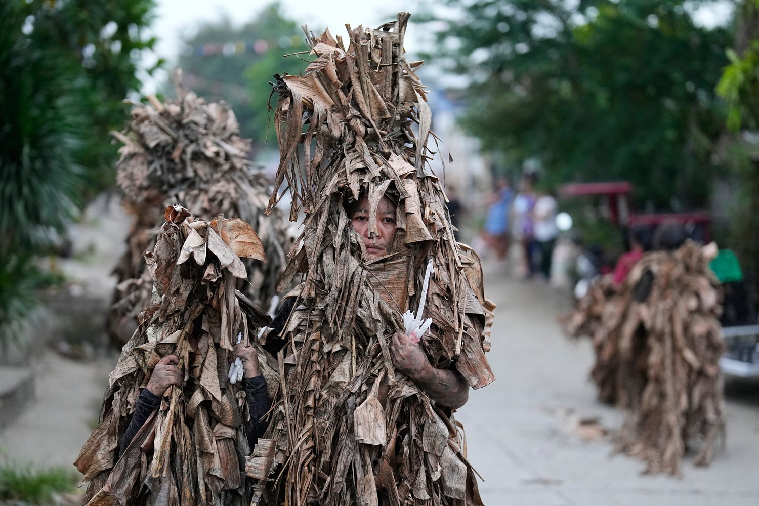 Philippine devotees honor St. John the Baptist with a mud-covered display of faith