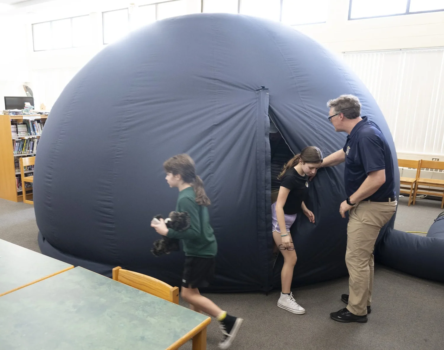 A universe under the dome: Inflatable planetarium brings space to JFK sixth graders
