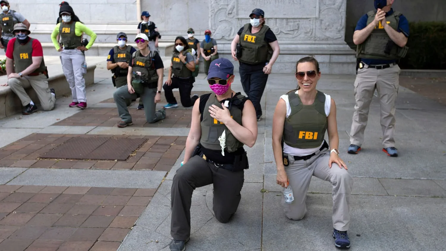 FBI fires agents photographed kneeling during 2020 racial justice protest, AP sources say