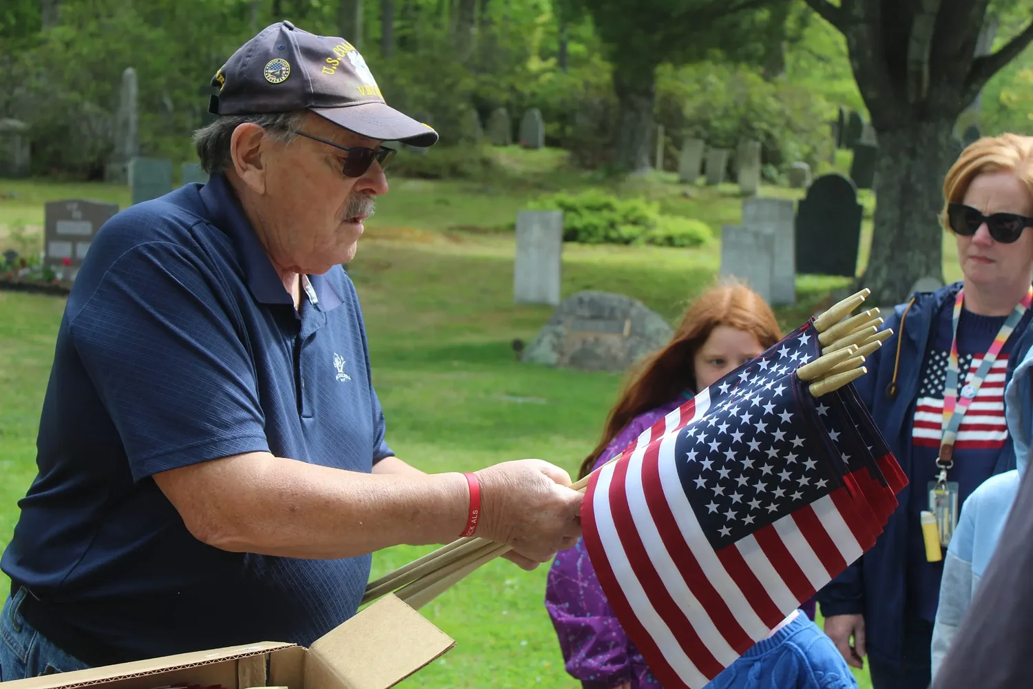 DCS students honor veterans by placing American flags at Dublin Cemetery