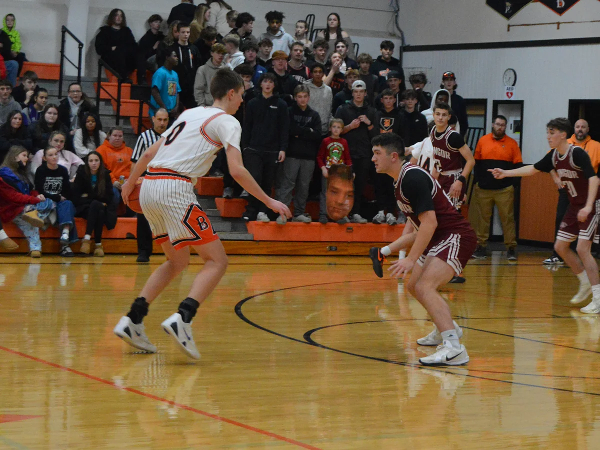 Back-to-back dunks showed why Oli Higgins looms large in Maine high school basketball