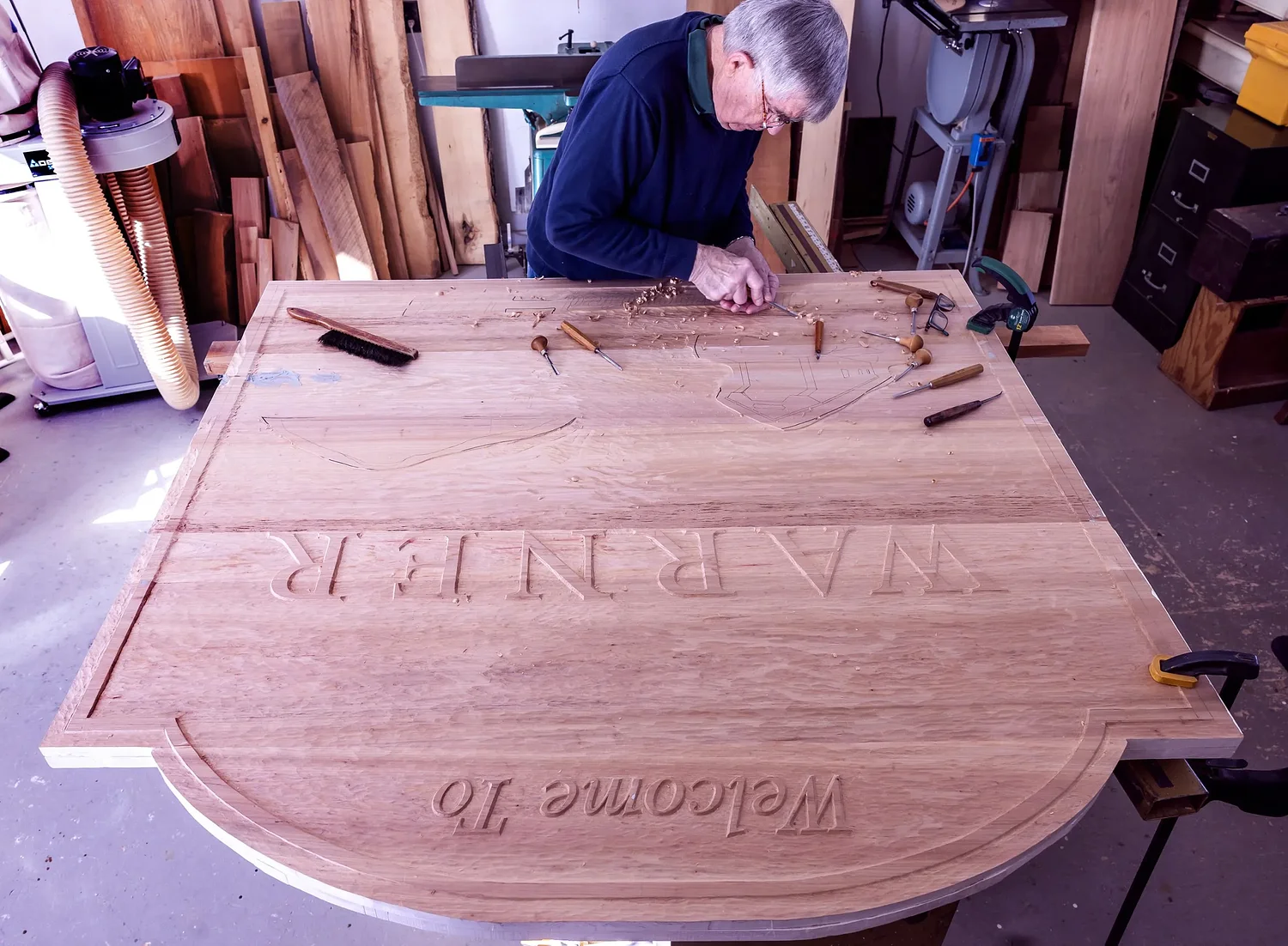 ‘I like giving joy to people’: NH woodworker carves a new welcome sign for Interstate exit
