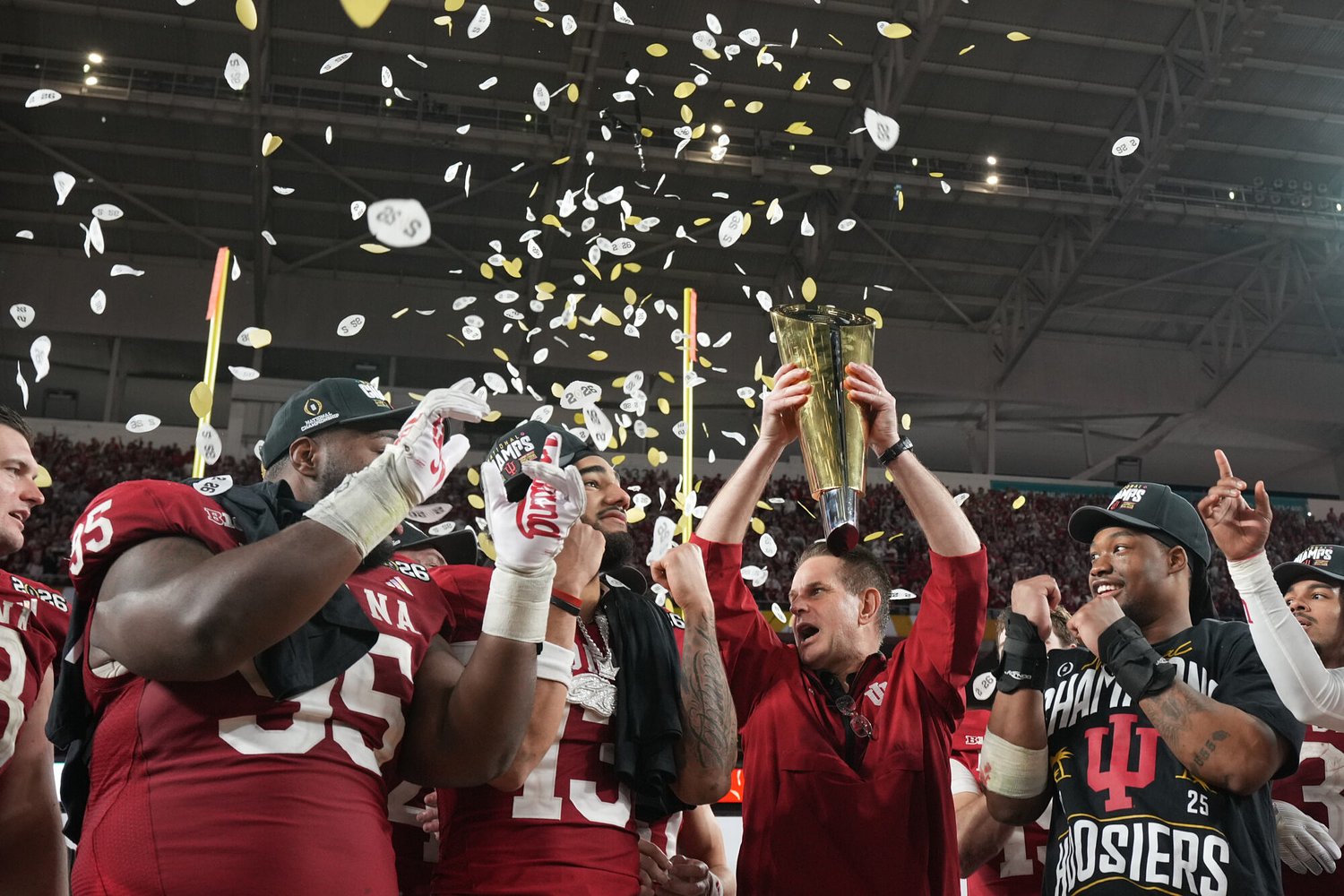 Indiana tops season's final AP Top 25 football poll. Ole Miss is 3rd, its highest rank since 1962