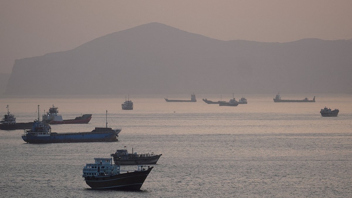 Iran says it forced US warship back from Strait of Hormuz, while US denies missile strike